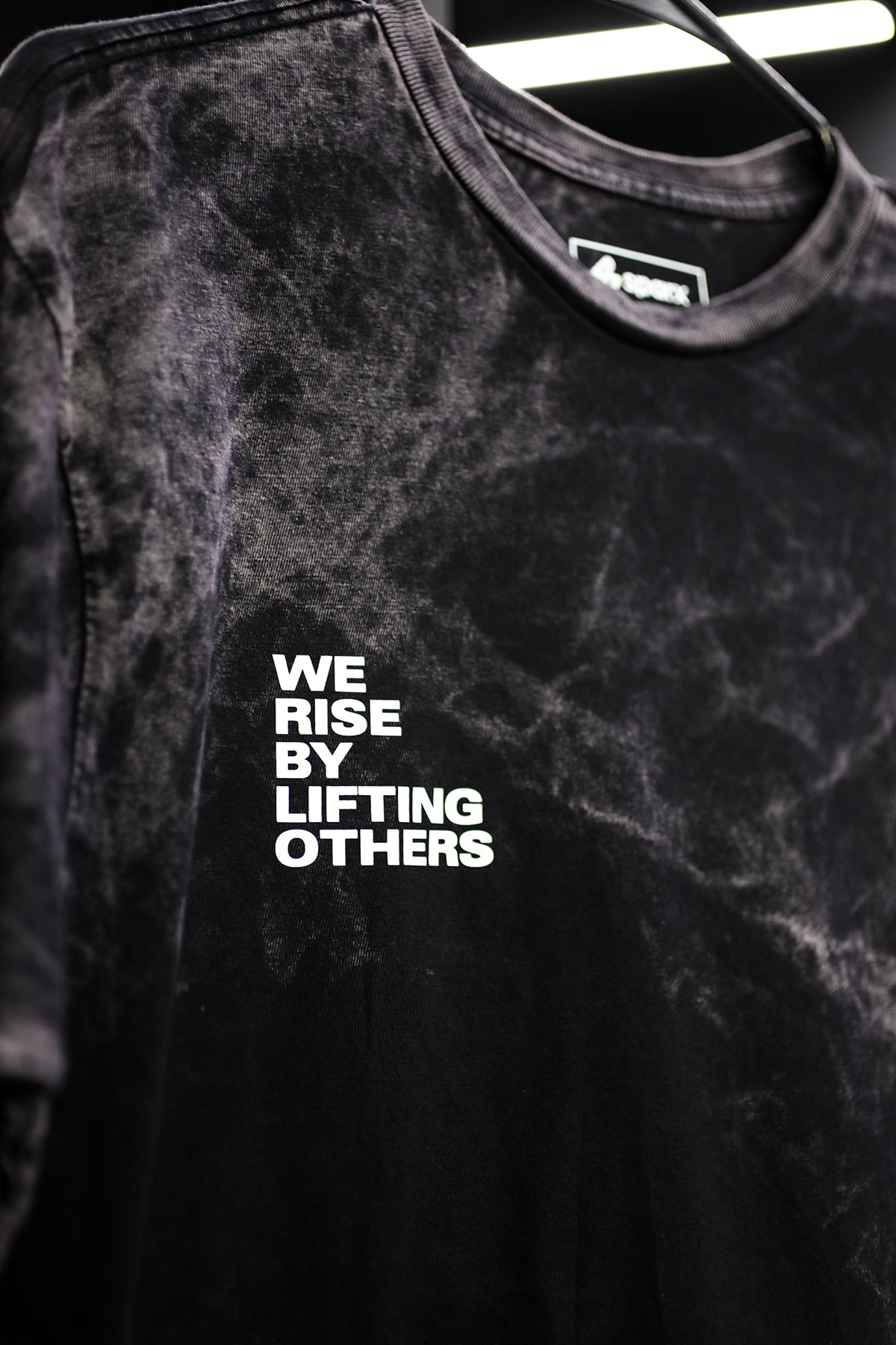 WE RISE BY LIFTING OTHERS // VINTAGE MARBLE WASH TEE